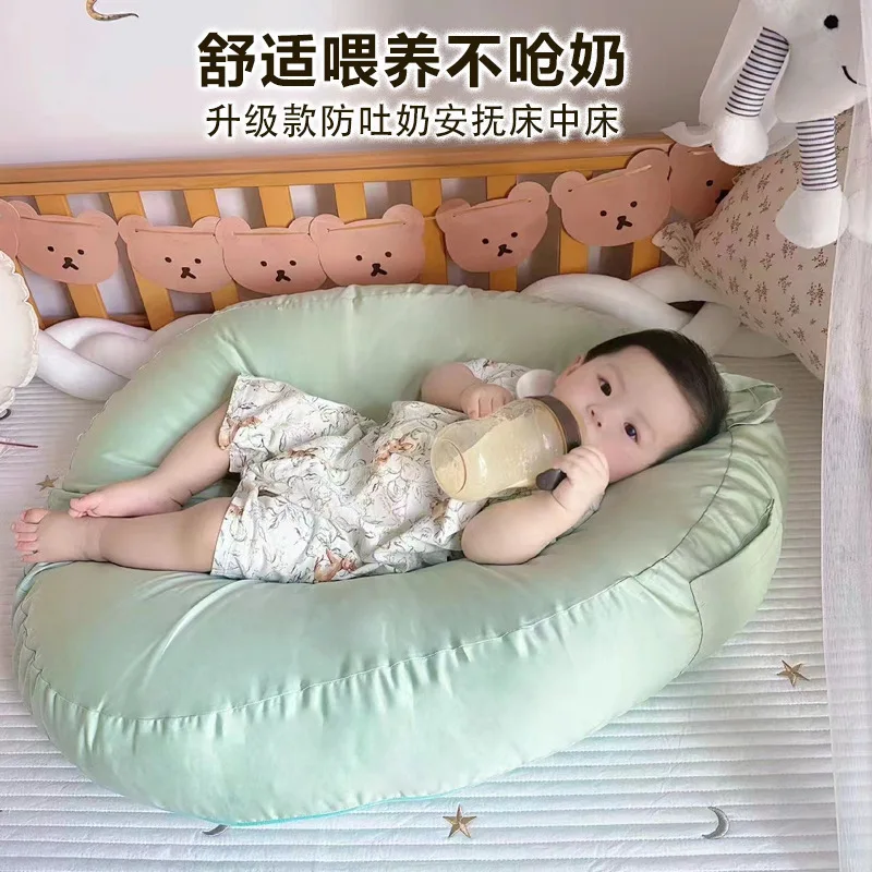 Almohada antipisaliva para bebés en uso
