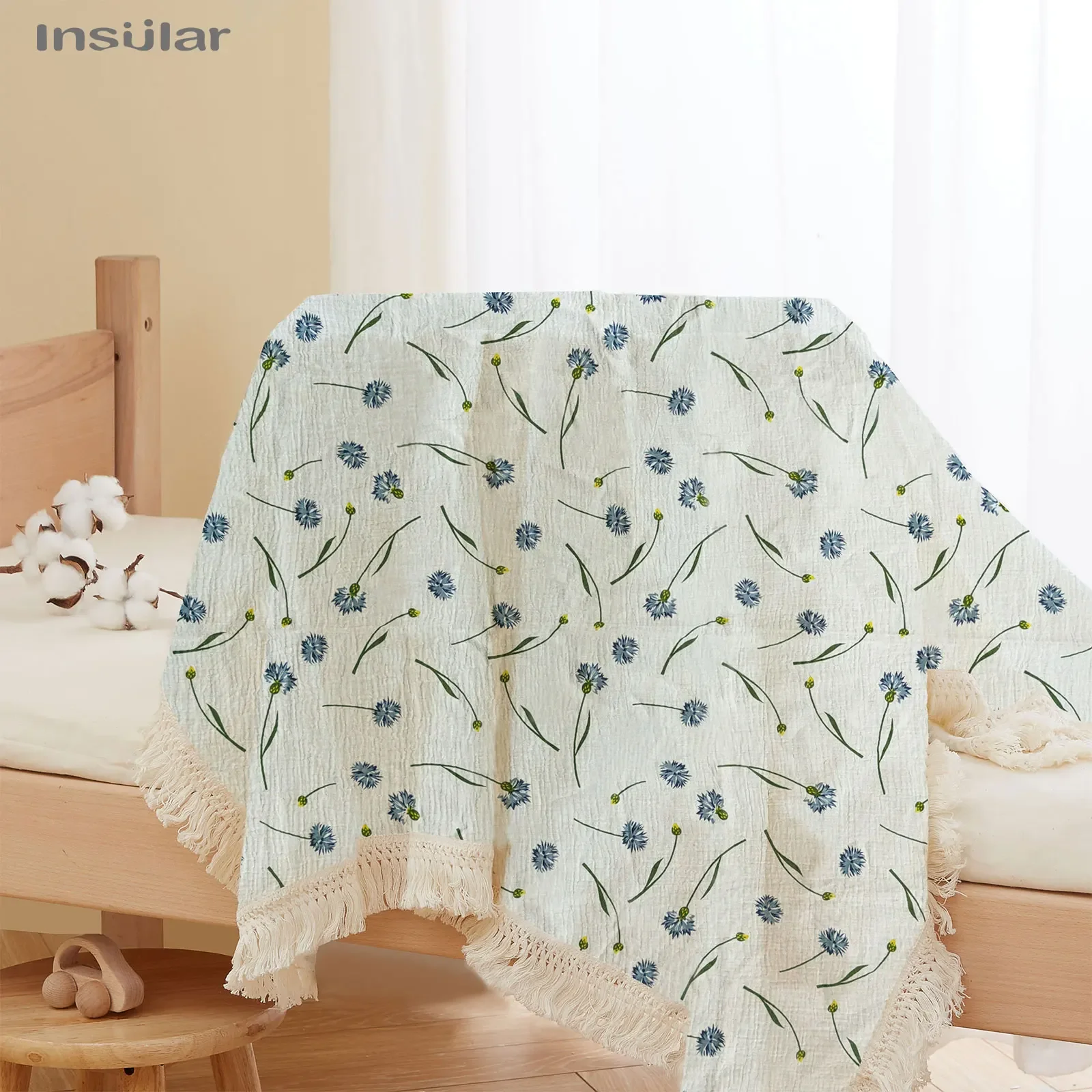 Manta de muselina para bebé con borlas y estampado envolvente