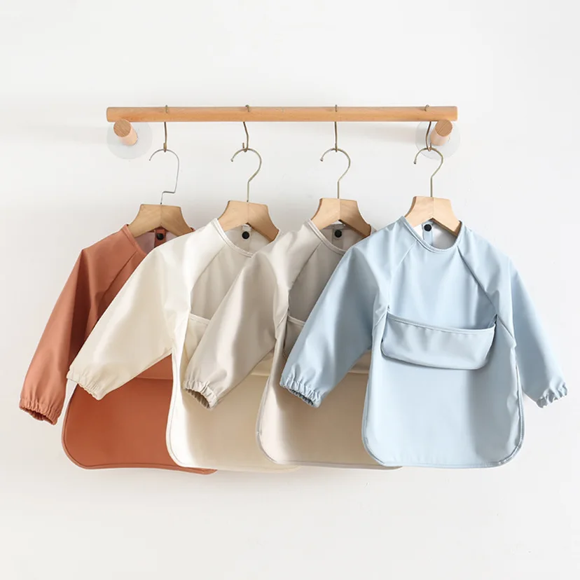 Babero impermeable manga larga para bebés – Con bolsillo, varios colores