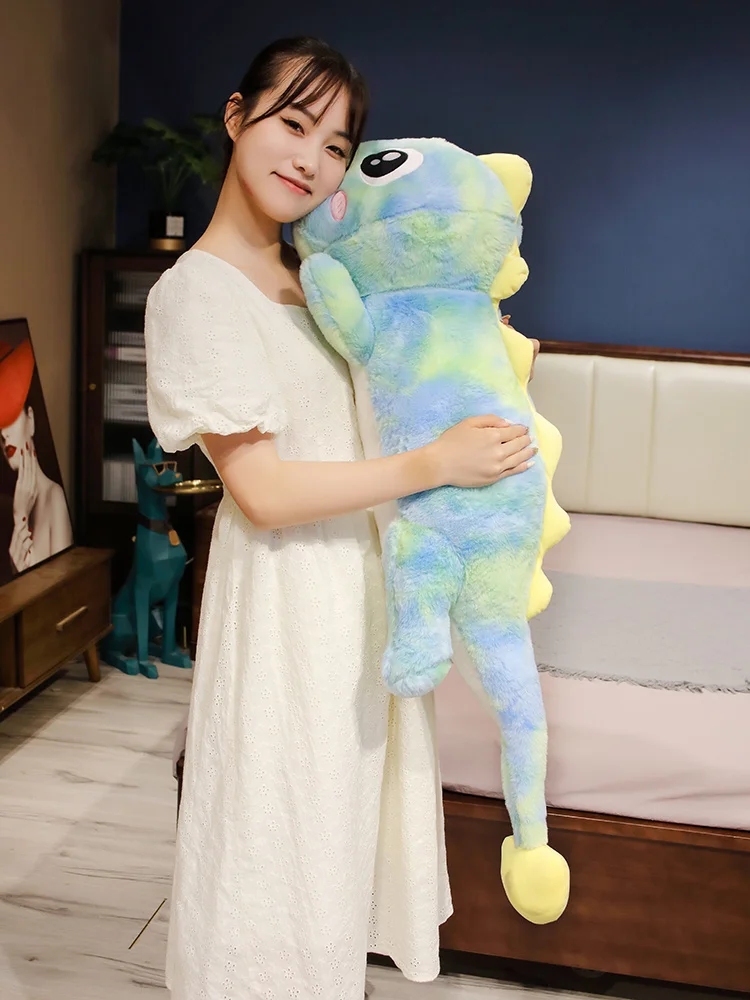 Peluche dinosaurio como almohada blandita