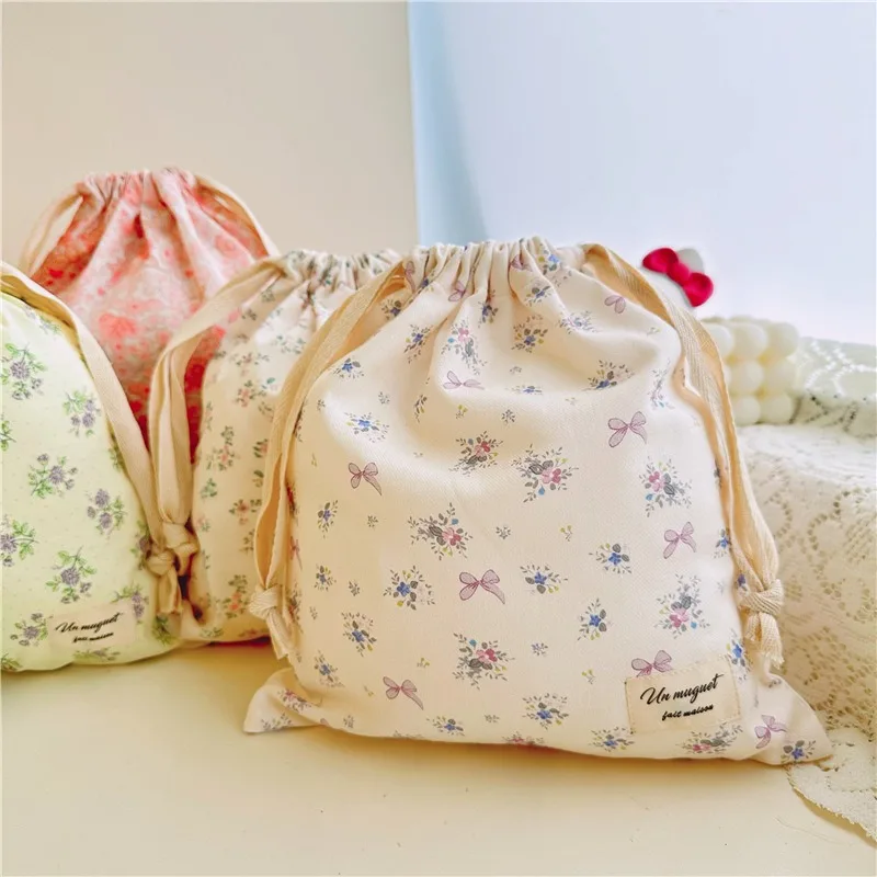 Bolsa para pañales de algodón con cordón y estampado floral