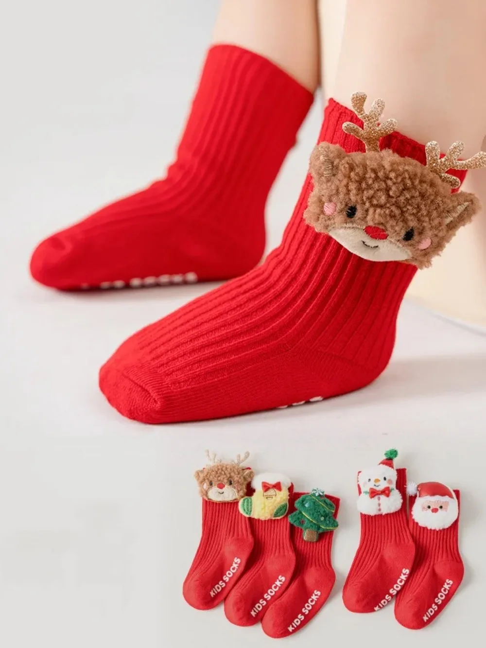 Calcetines infantiles de Papá Noel con detalle de muñeco de nieve