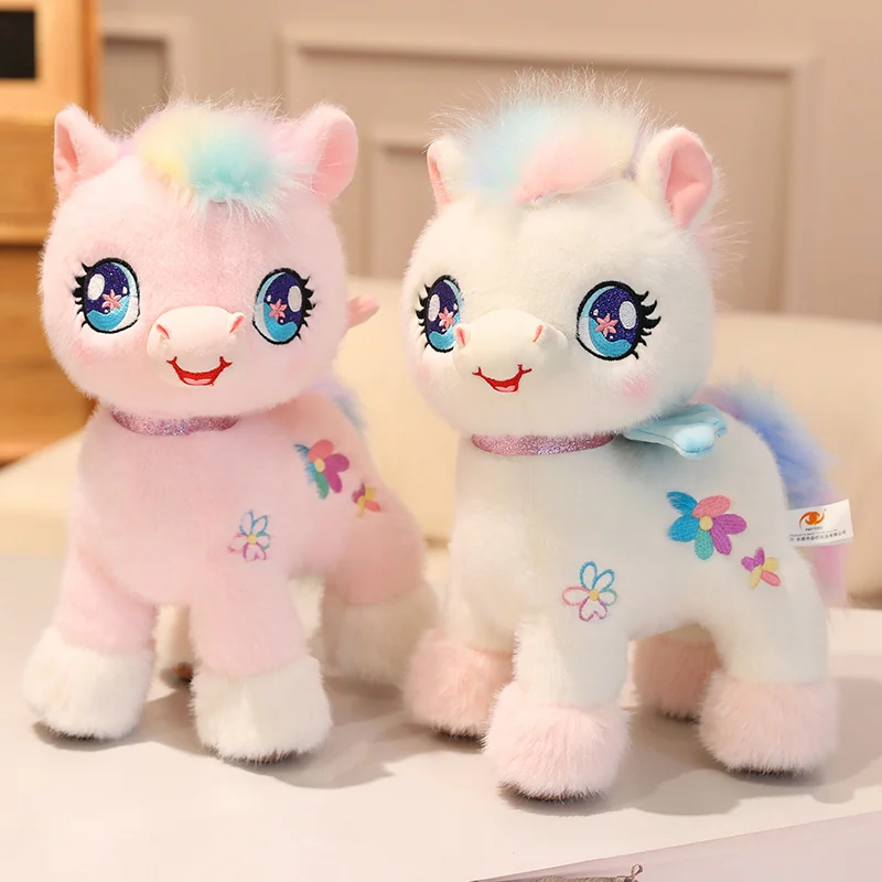Peluche unicornio rosa y blanco suave con alas arcoíris