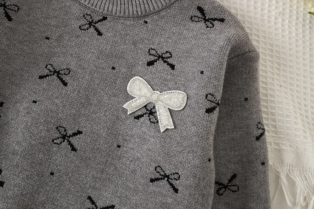 Milancel conjunto de punto para niña con jersey y falda plisada