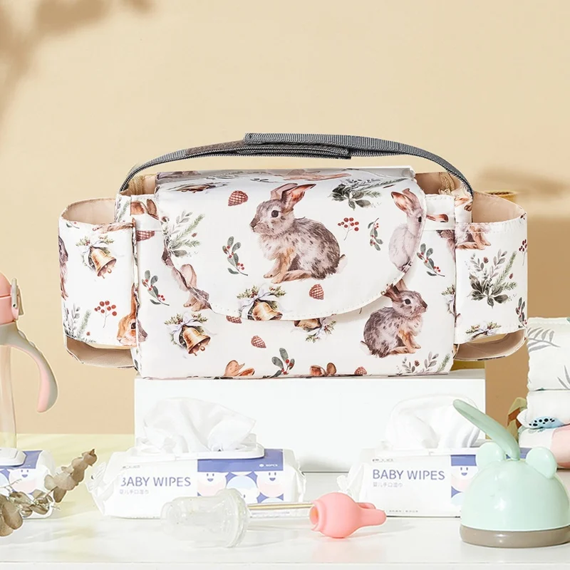 Bolsa colgante para carrito con organizador y porta biberones - imagen 4