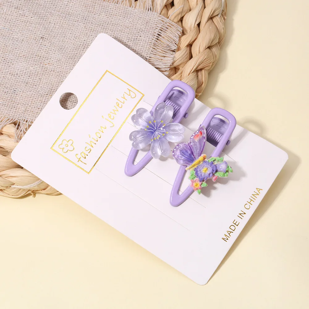 Pinzas de pelo infantiles con cereza y mariposa
