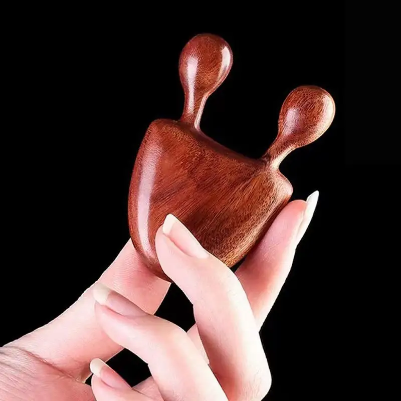 Masajeador nasal y facial de madera – Forma caracol para bebés - imagen 2