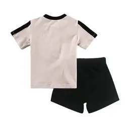 Conjunto bebé top de algodón, pantalón corto con botones y volantes