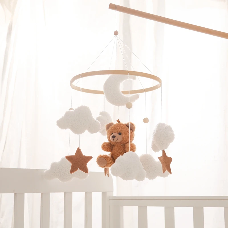 Móvil de cuna con osito de peluche y música suave - regalo bebé