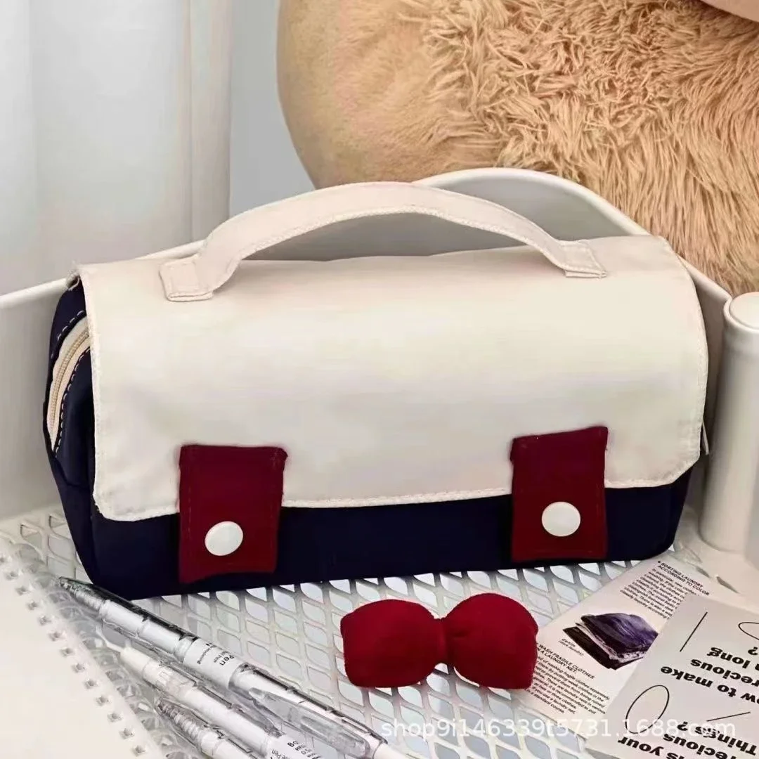 Bolsa organizadora de papelería con lazo decorativo