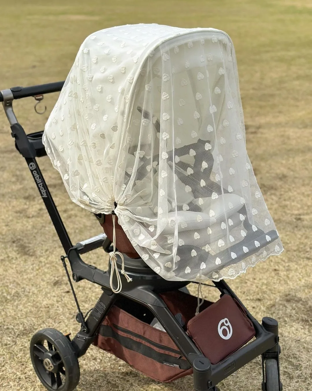 Cochecito con mosquitera y cobertura frontal