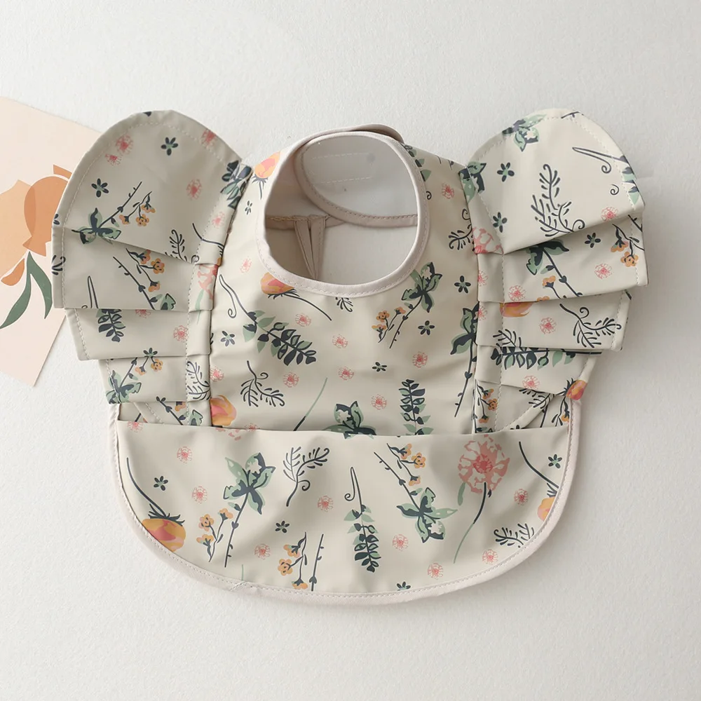 Babero impermeable con dibujos animados para la mesa