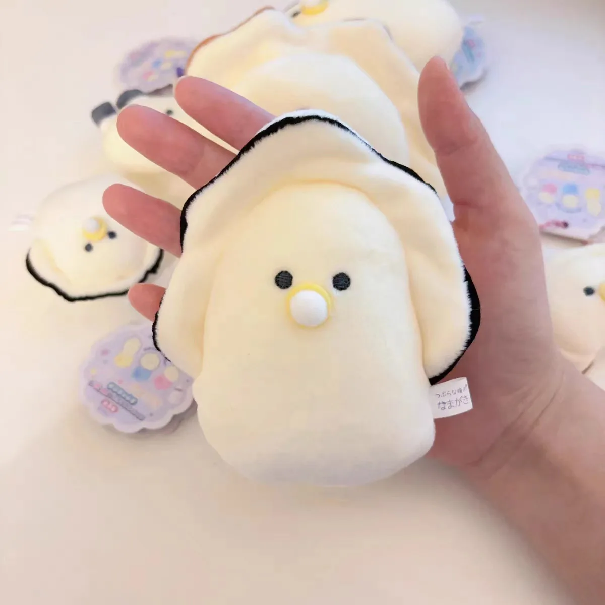 Detalle de la muñeca tipo vieira con chupete
