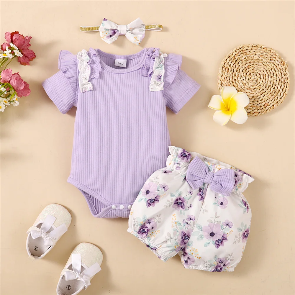 Pelele morado y pantalones florales para bebé niña
