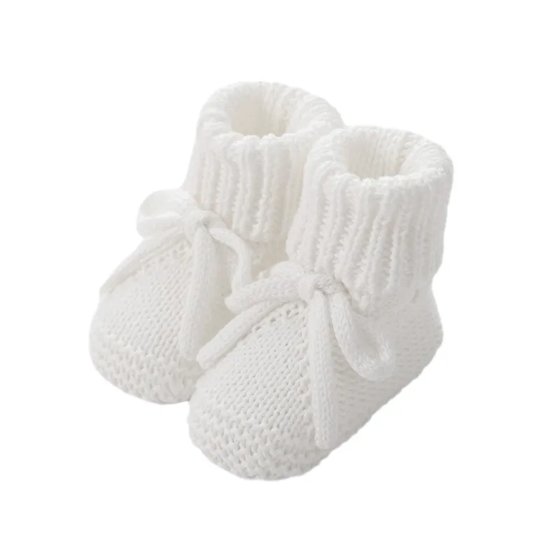 Zapatos de punto para bebé con lazos, ideales para gatear