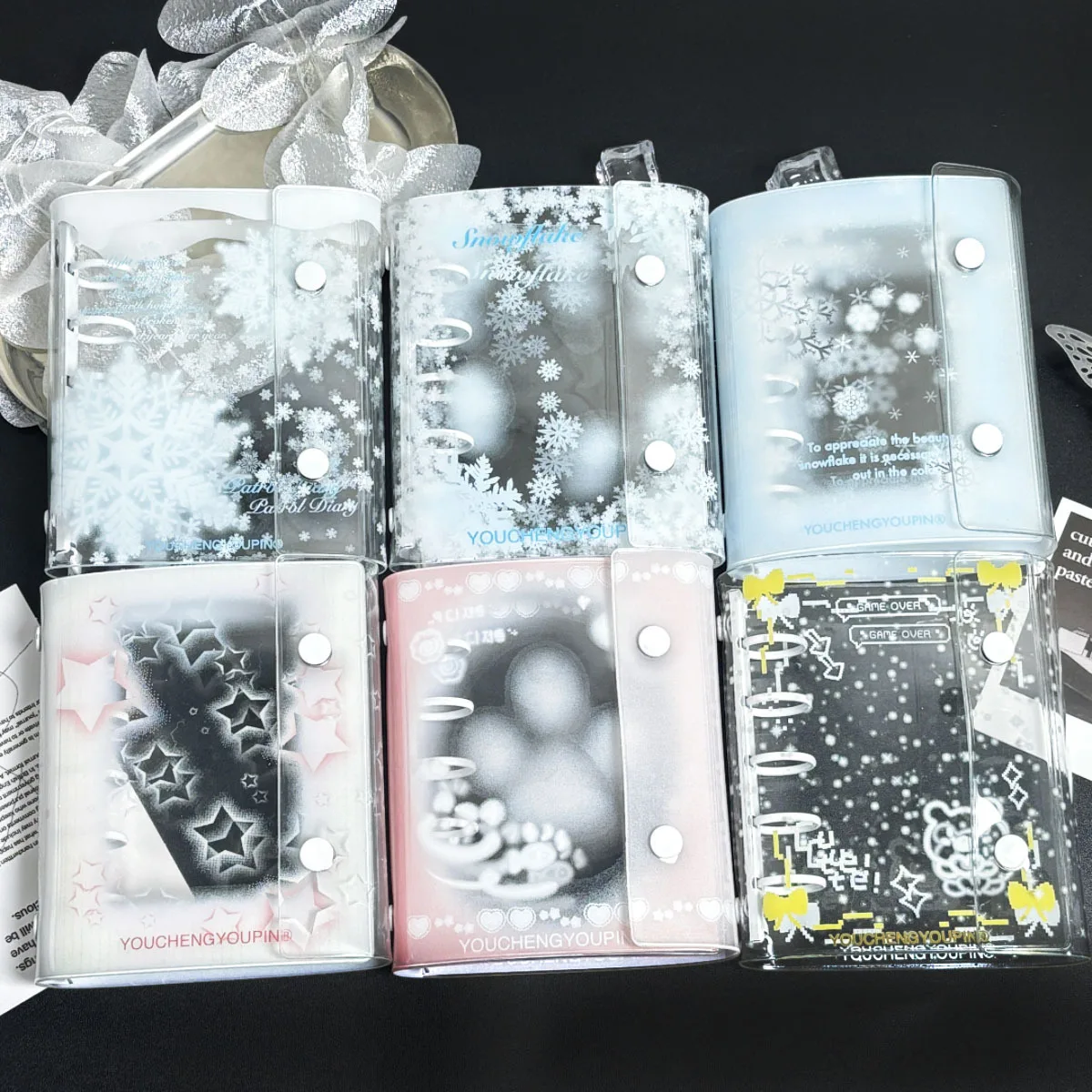 Carpeta transparente con doble botón para cuaderno escolar