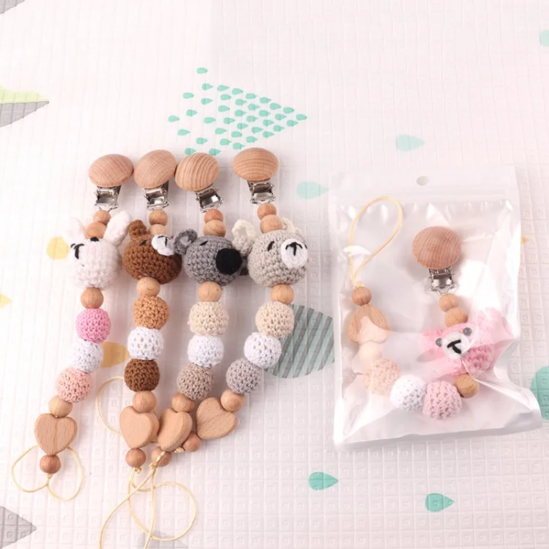 Clips para chupete en madera de haya anticaída con soporte