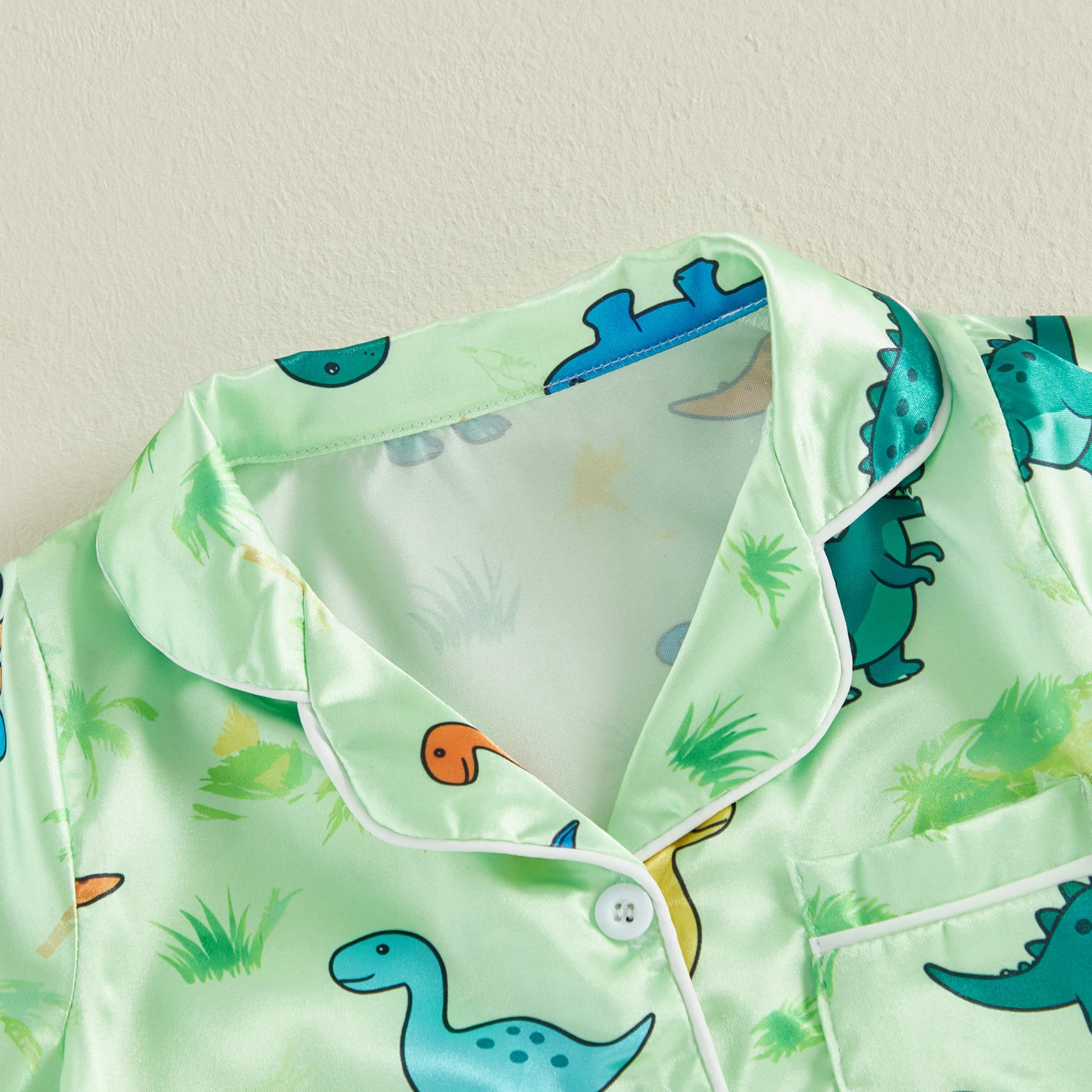 Pijama bebé con dinosaurios y cuello vuelto, manga corta - imagen 3