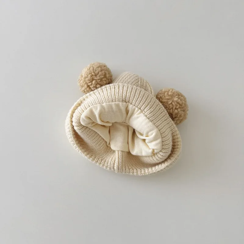 Gorro de bebé con orejeras de lana tejido y animales para invierno - imagen 3