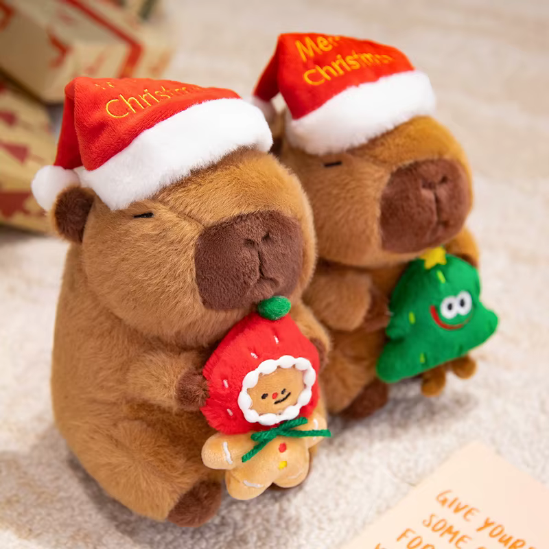 Peluche capibara con sombrero rojo de Navidad para dormir