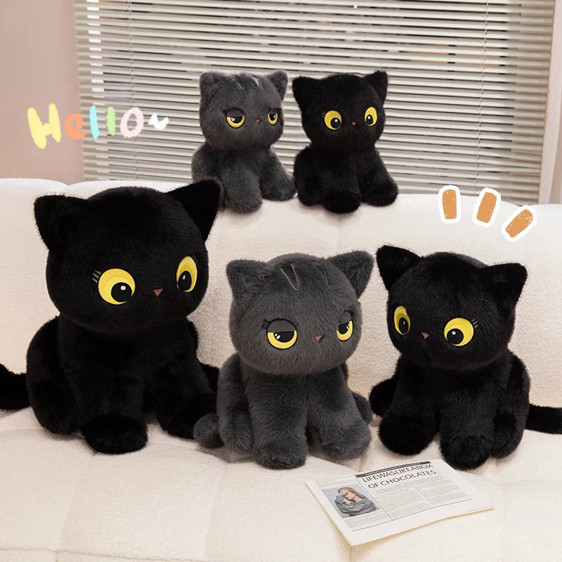 Cojín peluche gato negro sentado en posición sentada