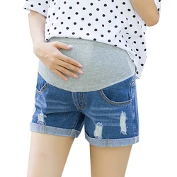 Jeans cortos de embarazo con cintura alta en denim azul holgado