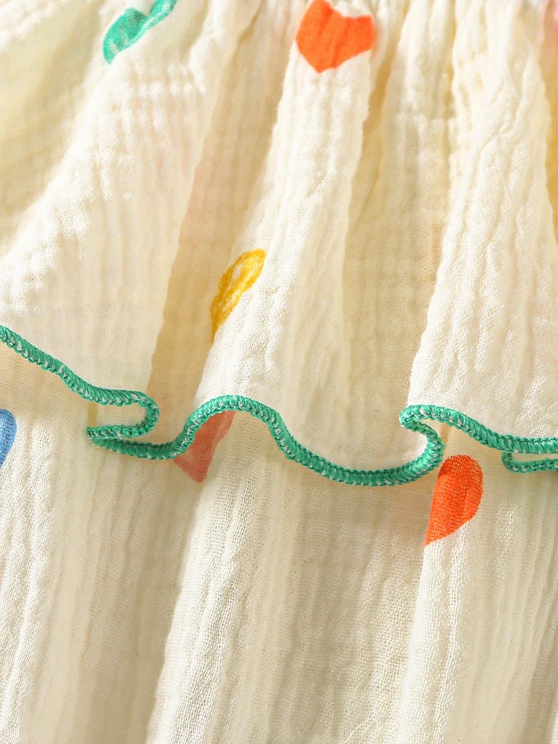 Mono tirantes niña de verano con estampado corazón y sombrero - imagen 3