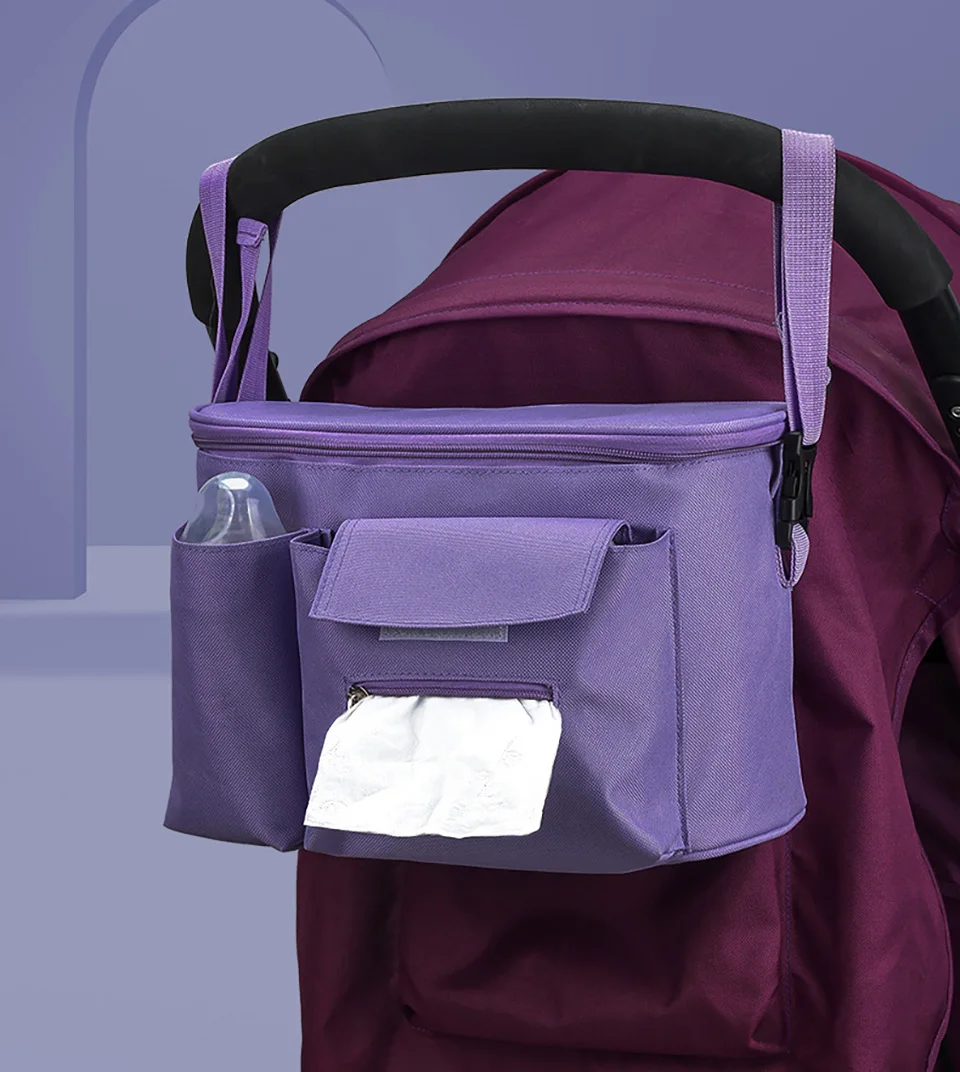 Bolsa de pañales para cochecito HOUSBAY en uso