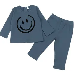 Pijama invierno niños y niñas – Top y pants acanalado con motivo sonriente