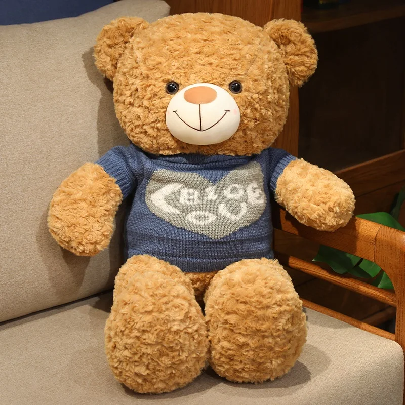 Niño abrazando al oso de peluche BABIQU de 75 cm