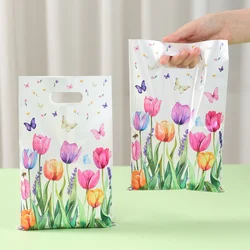 Bolsas de regalo decoradas con mariposas y tulipanes para fiestas infantiles