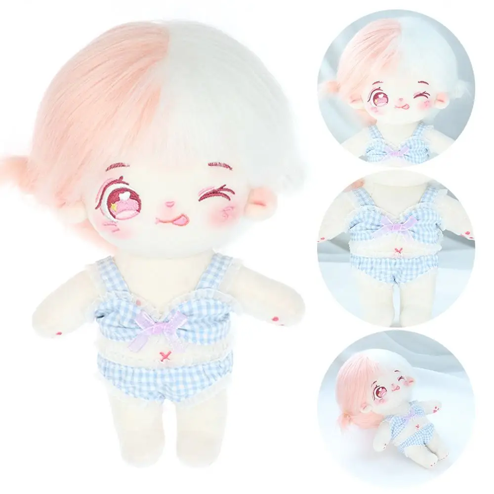 Conjunto de ropa para muñeca 20 cm mostrando traje de baño y albornoz